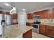 Lovely kitchen featuring granite counters, stainless appliances, and ample storage at 5325 Sandy Shell Dr, Apollo Beach, FL 33572