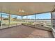 Relaxing screened lanai with brick flooring, offering beautiful lake views and a tranquil atmosphere at 5325 Sandy Shell Dr, Apollo Beach, FL 33572
