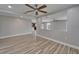 Open-concept living room with tile floors, recessed lighting, and a view into the kitchen, great for entertaining at 5325 Sandy Shell Dr, Apollo Beach, FL 33572