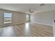Bright and airy living room featuring tile floors and large windows with beautiful view of the lake at 5325 Sandy Shell Dr, Apollo Beach, FL 33572