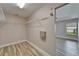 A walk-in closet with wire shelving and wood-style flooring located off the main bedroom at 5325 Sandy Shell Dr, Apollo Beach, FL 33572
