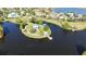 Aerial view of a gazebo and pier on a small island in a picturesque community lake at 5325 Sandy Shell Dr, Apollo Beach, FL 33572
