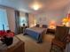 Bedroom with a soft carpet, natural light and side tables with lamps at 5403 Comanche St, Zephyrhills, FL 33542