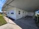 This single-story home features a covered patio and well-maintained landscaping at 5403 Comanche St, Zephyrhills, FL 33542