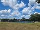 Outdoor pickleball courts with blue and green playing surfaces, surrounded by fencing and lush landscaping for community enjoyment at 5403 Comanche St, Zephyrhills, FL 33542