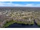 Aerial view of houses, yards, and rooftops in a neighborhood setting at 5804 Bitter Orange Ave, Tampa, FL 33625