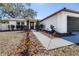 Welcoming walkway leads to front door, enhanced by new mulch and plants at 705 Climate Dr, Brandon, FL 33511