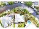 Aerial view of a waterfront home showcasing the beautiful landscaping, private pool, and serene surroundings at 809 30Th E Ct, Bradenton, FL 34208
