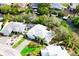 Waterfront property with lush landscaping, private pool, and a charming patio with canal access at 809 30Th E Ct, Bradenton, FL 34208