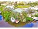 Wide aerial view of homes on canal with docks and boat lifts at 809 30Th E Ct, Bradenton, FL 34208