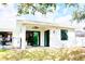Outdoor patio with kitchen access, seamlessly blending indoor-outdoor living with backyard views and a pool at 809 30Th E Ct, Bradenton, FL 34208
