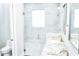 Modern bathroom features a glass-enclosed shower, dual vanities, and contemporary fixtures at 809 30Th E Ct, Bradenton, FL 34208