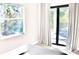 Bedroom with large window and sliding glass door providing ample natural light and outdoor views at 809 30Th E Ct, Bradenton, FL 34208
