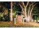 Charming wooden dock with string lights, nestled amongst trees for a relaxed outdoor retreat at 809 30Th E Ct, Bradenton, FL 34208