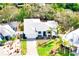 Modern, single-story home featuring a white exterior, attached garage, and well-manicured landscaping and pavers at 809 30Th E Ct, Bradenton, FL 34208