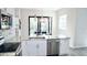 Modern kitchen with stainless steel appliances, granite counters, and white cabinets at 809 30Th E Ct, Bradenton, FL 34208