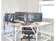 Home office space featuring computer setup, L-shaped desk with modern black and red chair at 809 30Th E Ct, Bradenton, FL 34208
