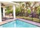Backyard pool featuring privacy fence, patio and view of tropical foliage at 809 30Th E Ct, Bradenton, FL 34208