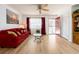 View of the living room with a ceiling fan and a decorative side table at 8623 140Th Way, Seminole, FL 33776