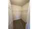 Walk-in closet with wood-look floors and white shelving at 9208 Hillcroft Dr, Riverview, FL 33578