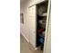 Linen closet with white shelving containing blankets, towels, and bins for storage at 9208 Hillcroft Dr, Riverview, FL 33578