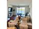 Inviting living area featuring a seamless flow to the outdoor patio and lake view at 9208 Hillcroft Dr, Riverview, FL 33578