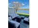 Relaxing patio with plush outdoor furniture and a serene lake view at 9208 Hillcroft Dr, Riverview, FL 33578