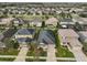 A beautiful aerial view of the house showing the neighborhood and roof top at 9244 Bella Vita Cir, Land O Lakes, FL 34637