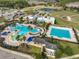 Aerial view of community pool area and clubhouse at 9244 Bella Vita Cir, Land O Lakes, FL 34637