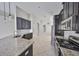 Modern kitchen featuring granite countertops, tiled backsplash, and stainless steel appliances at 9244 Bella Vita Cir, Land O Lakes, FL 34637