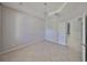 Inviting room with tile flooring, a chandelier, and an open doorway, perfect for entertaining at 9244 Bella Vita Cir, Land O Lakes, FL 34637