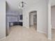 Large living room showing view to kitchen with granite countertops and breakfast bar at 9244 Bella Vita Cir, Land O Lakes, FL 34637