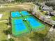 Aerial view of community sports courts including basketball and tennis at 9244 Bella Vita Cir, Land O Lakes, FL 34637