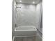 Updated bathroom with white tile and modern fixtures at 10351 Regal Dr # 10, Largo, FL 33774