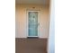 Image shows front door to unit 10 with neutral exterior at 10351 Regal Dr # 10, Largo, FL 33774