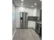 Updated kitchen featuring granite countertops, stainless steel appliances, and ample storage at 10351 Regal Dr # 10, Largo, FL 33774