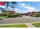 Attractive condos with manicured landscaping, tile roofs, and a common parking area at 10351 Regal Dr # 10, Largo, FL 33774