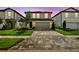 Beautiful curb appeal of this home with a two-car garage and paved driveway leading to the front door at 10352 Cross River Trl, Parrish, FL 34219