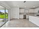 Bright kitchen and dining area with sliding door to backyard, stainless steel appliances, tile floors at 10352 Cross River Trl, Parrish, FL 34219