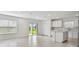 Bright kitchen and dining area with sliding door to backyard, stainless steel appliances, tile floors at 10352 Cross River Trl, Parrish, FL 34219