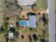 Bird's eye view of the home and pool area, showing the layout and neighborhood at 10925 Fort King Rd, Dade City, FL 33525