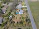 Lovely home with a private screened pool, nestled among lush greenery and mature trees at 10925 Fort King Rd, Dade City, FL 33525