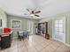Bright dining area with tile floors and a view through the window at 10925 Fort King Rd, Dade City, FL 33525