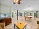 Spacious game room with tile flooring, pool table, and decorative support beam at 10925 Fort King Rd, Dade City, FL 33525