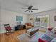 Cozy living room with hardwood floors, natural light, and comfortable furnishings, creating a warm and inviting space at 10925 Fort King Rd, Dade City, FL 33525