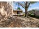 Expansive backyard featuring a deck, mature tree, and low-maintenance gravel ground cover at 1520 15Th N St, St Petersburg, FL 33704