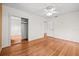 Bright bedroom with hardwood floors, closet, and a ceiling fan at 1520 15Th N St, St Petersburg, FL 33704