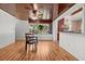 Cozy dining room with wood floors, a view of the kitchen, and ample natural light at 1520 15Th N St, St Petersburg, FL 33704