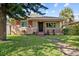 Inviting single-story home featuring a well-manicured lawn, walkway, and front porch at 1520 15Th N St, St Petersburg, FL 33704