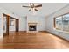 Bright living room with wood floors, fireplace, and natural light at 1520 15Th N St, St Petersburg, FL 33704